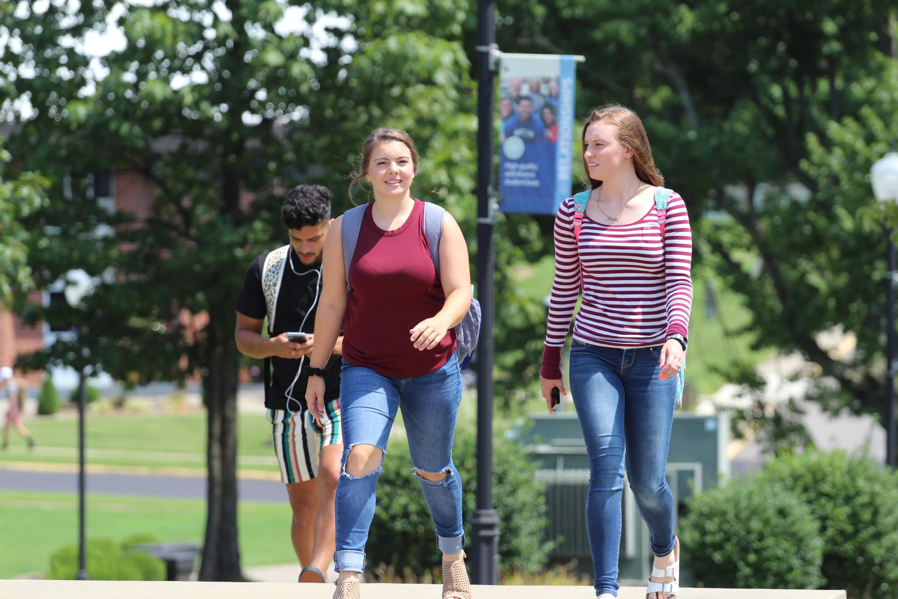 students walking across campus